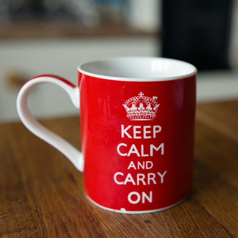 image of a mug with "Keep Calm Carry On" caption by marc pell unsplash